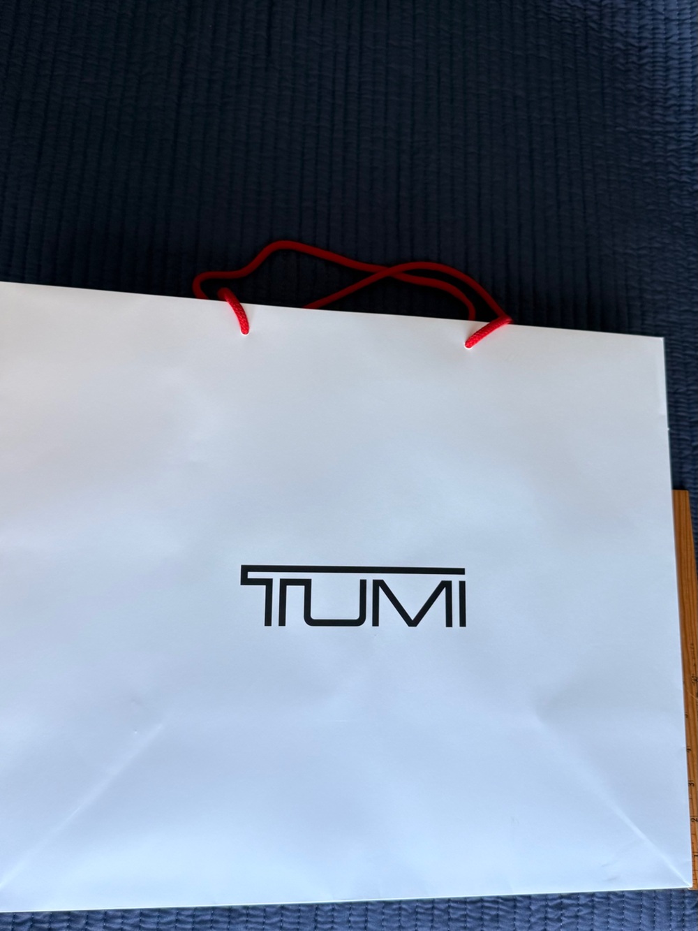 Tumi White Gift Bag with Red Rope Handles